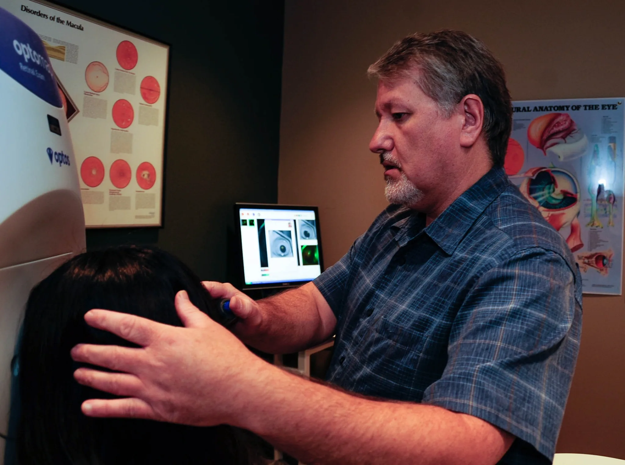 Clinical retinal imaging equipment in use during patient examination